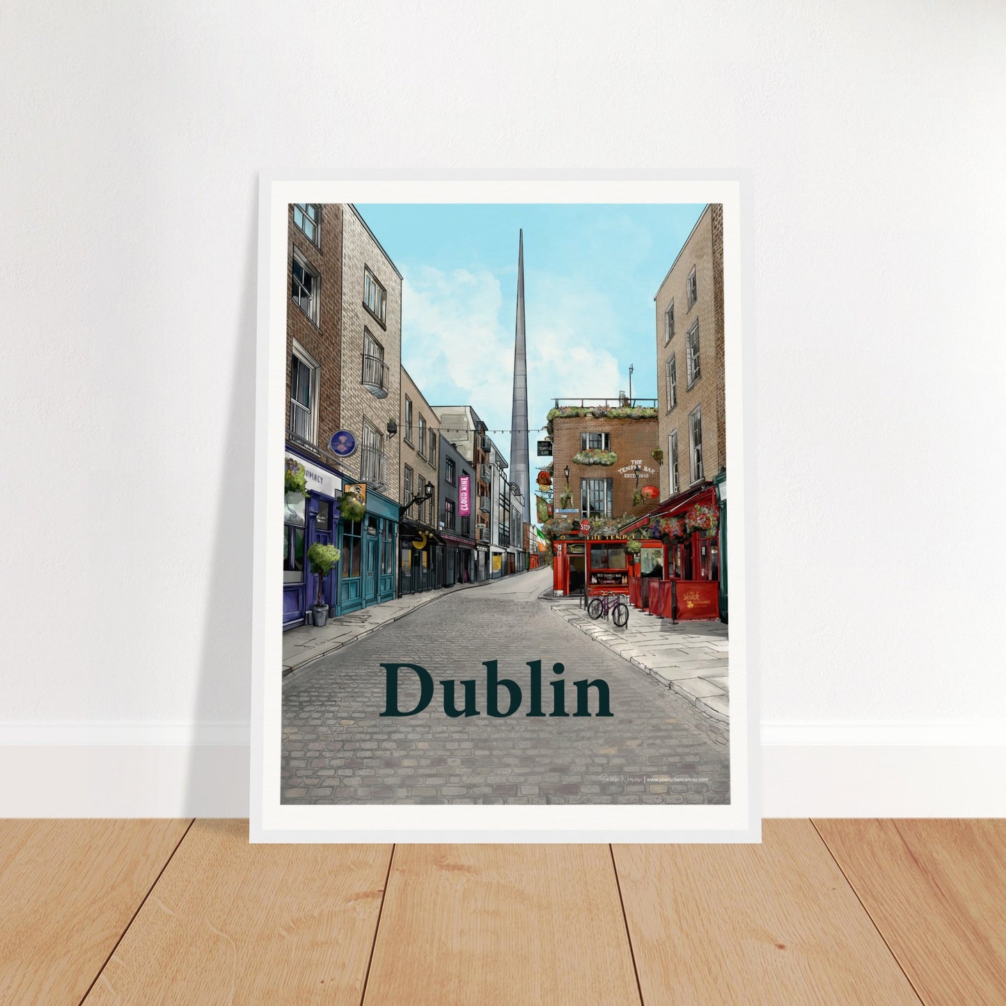 Dublin - Bold Typography print, size 45x60cm, framed in white wood, with a vibrant scene of Temple Bar's cobbled street, period buildings, The Temple Bar Inn, and The Spire in the distance