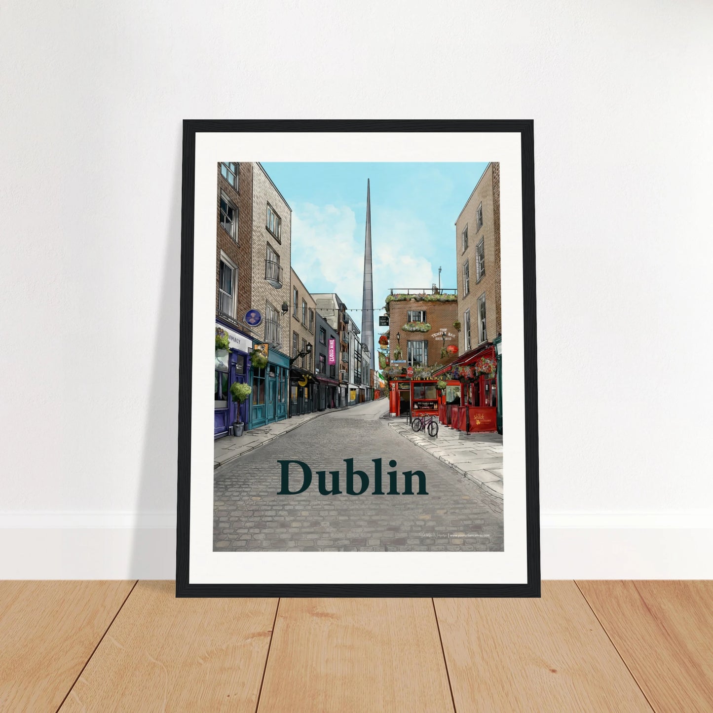 Dublin - Bold Typography print, size 30x40cm, framed in black wood, featuring a cobbled street in Temple Bar, The Temple Bar Inn, and The Spire towering in the background.