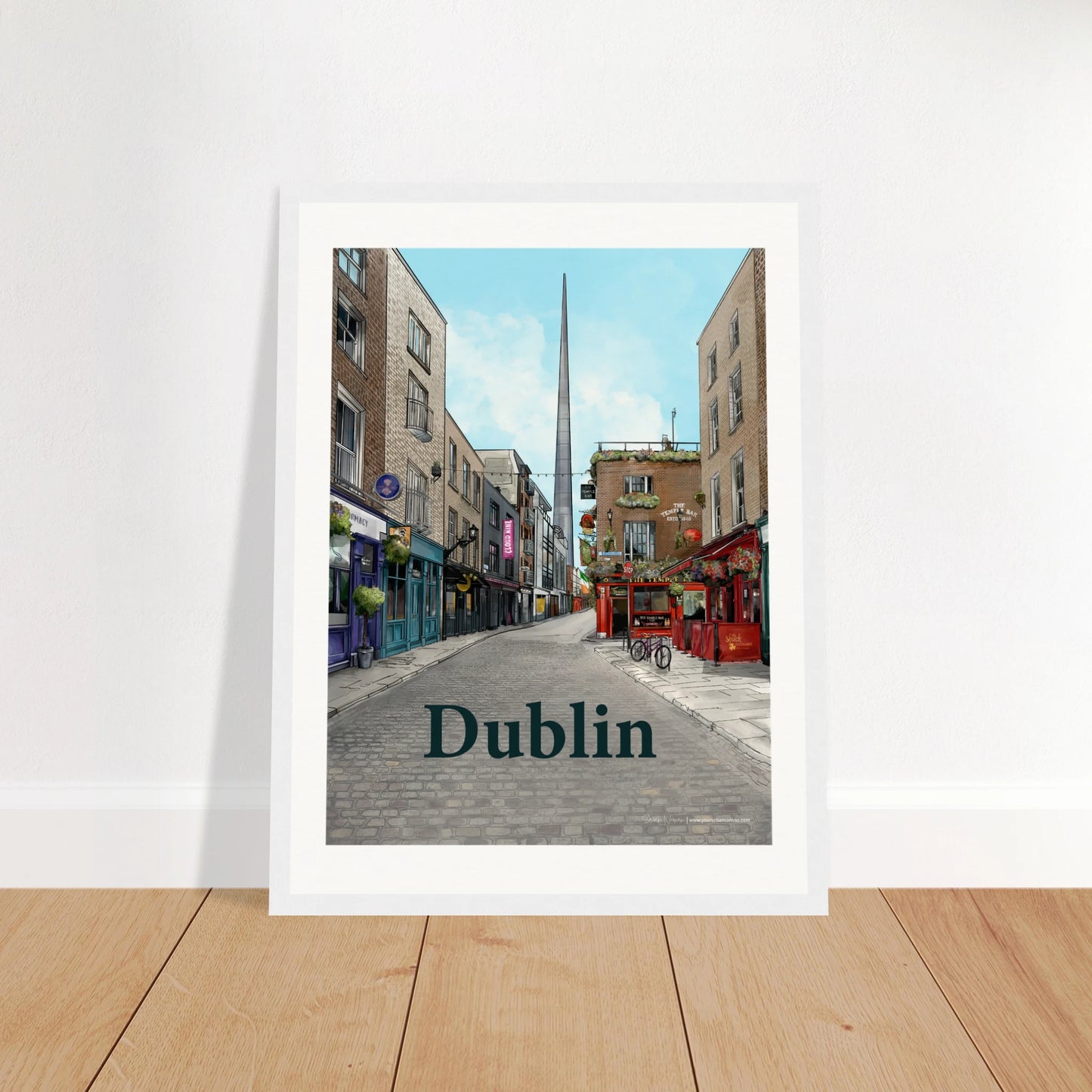 Dublin - Bold Typography print, size 30x40cm, framed in white wood, showcasing Temple Bar's cobbled streets, traditional shopfronts, and The Temple Bar Inn with The Spire in the distance
