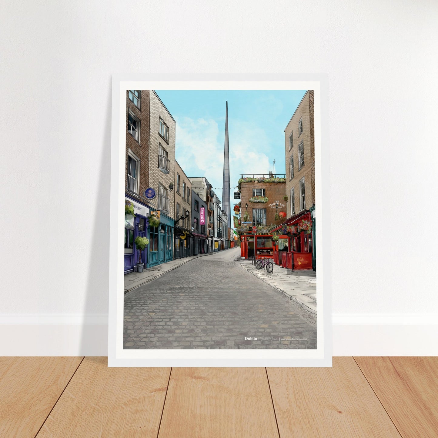 Dublin - Subtle Title print, size 30x40cm, framed in white, highlighting Temple Bar, the Temple Bar Inn, and the Spire on Dublin's vibrant cobbled streets.