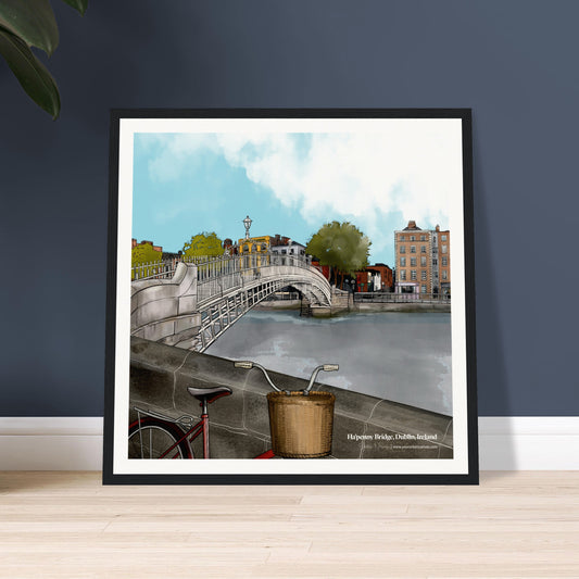 Framed artwork of a Dublin cityscape with the Ha'penny Bridge and River Liffey, featuring a bicycle leaning against the river wall and Georgian Buildings in the background. 