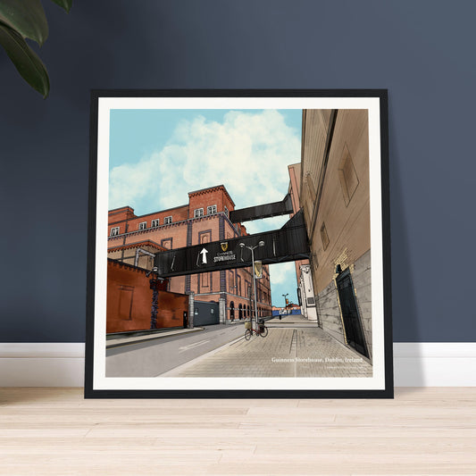 Framed artwork of a bold urban composition of the Guinness Storehouse in Dublin this piece pays tribute to the legacy of Guinness and its place in Ireland’s cultural landscape on a dark blue wall.