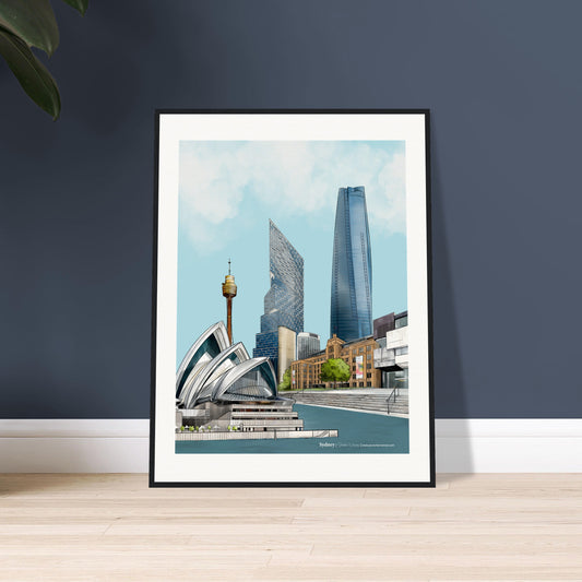 Framed artwork of a Sydney cityscape with  featuring the stunning Sydney Opera House, the Museum of Contemporary Art (MCA), Sydney Harbour, One Barangaroo, Quay Quarter Tower, and the Sydney Tower Eye in intricate detail displayed on a dark blue wall.