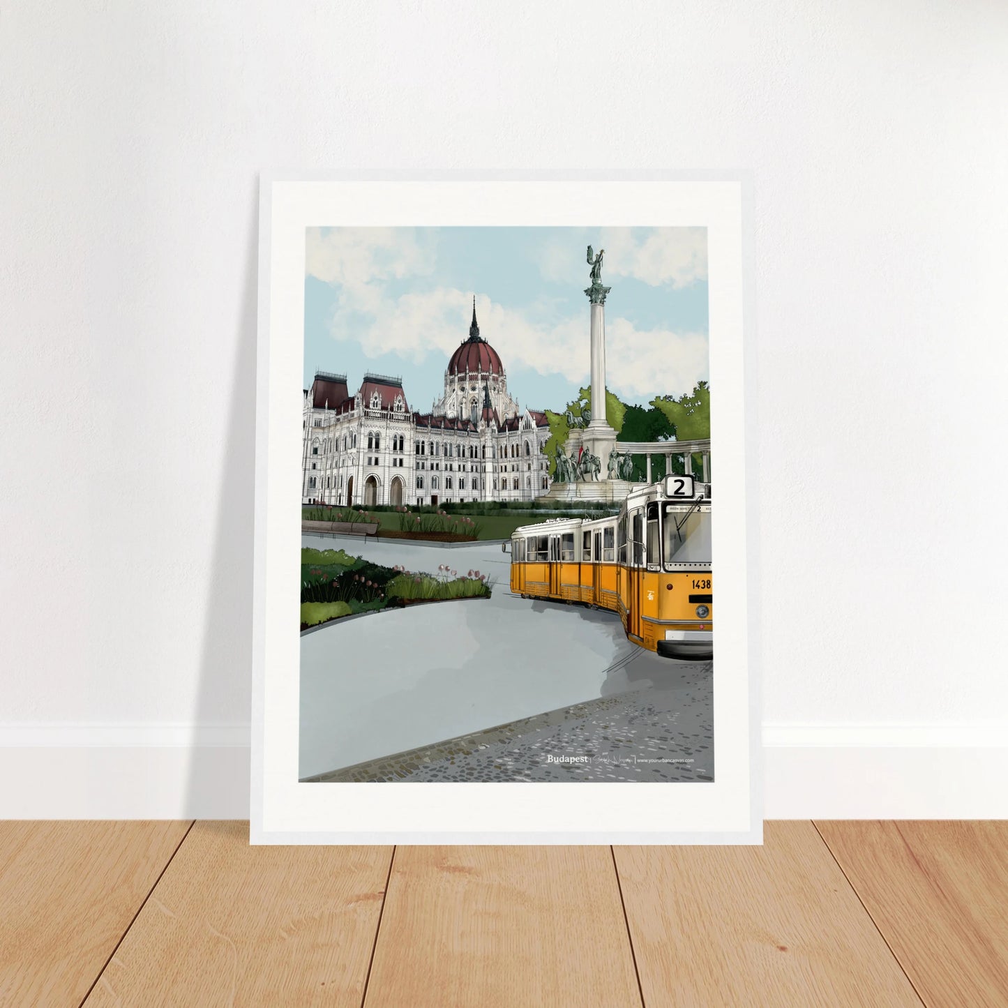 Budapest - Subtle Title print, size 45x60cm, framed in white, displaying the majestic Heroes' Square, the Hungarian Parliament, and the yellow tram moving across Budapest's charming cobbled streets.